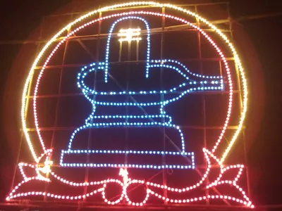 A neon sign outlines a figure in lights in Andhra Pradesh.