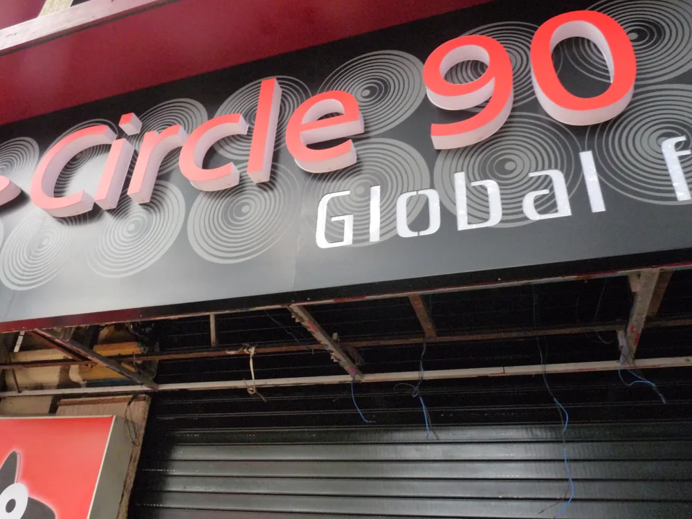 Circle 90 fascia in Pune with the tray still open and the wiring hanging while the sign is fitted.