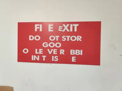 A sign board is missing letters and is waiting for a repair visit.