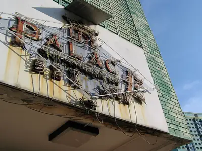 A rusted neon sign has failed and needs the frame and the tubing put right.